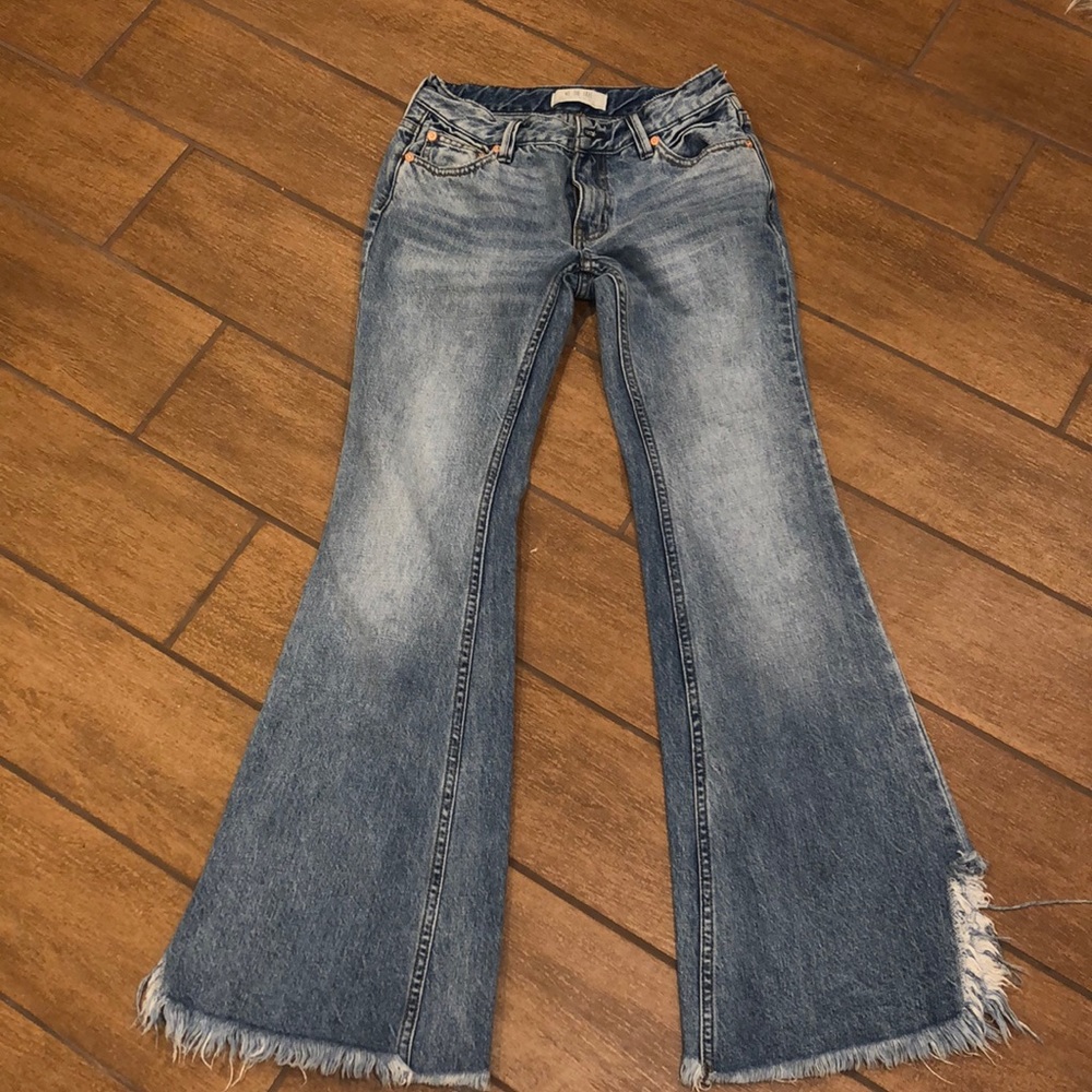 WE THE FREE raw hem flare jean